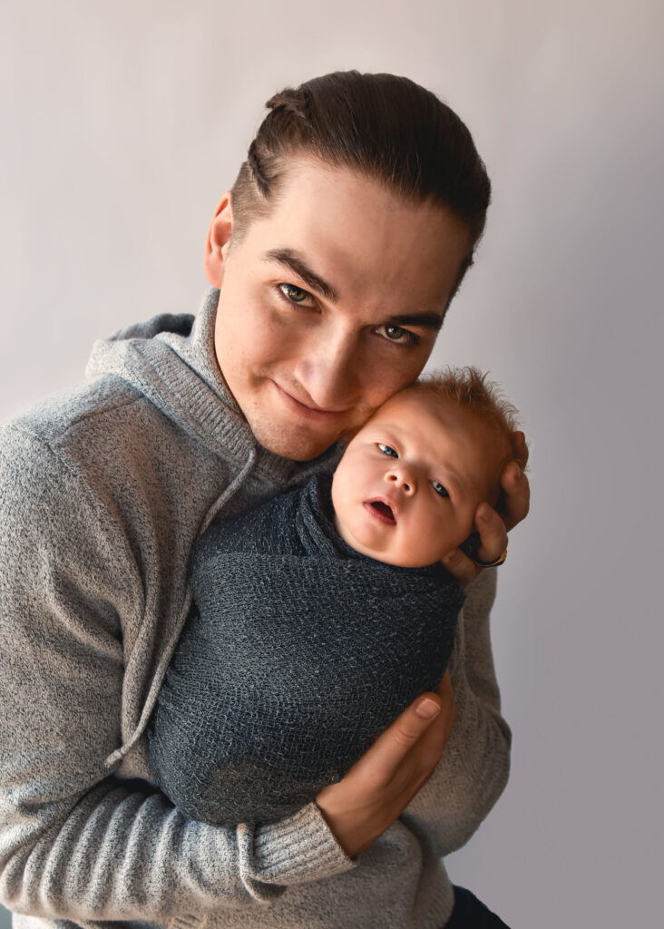 studio newborn session, dad and baby boy with faces close