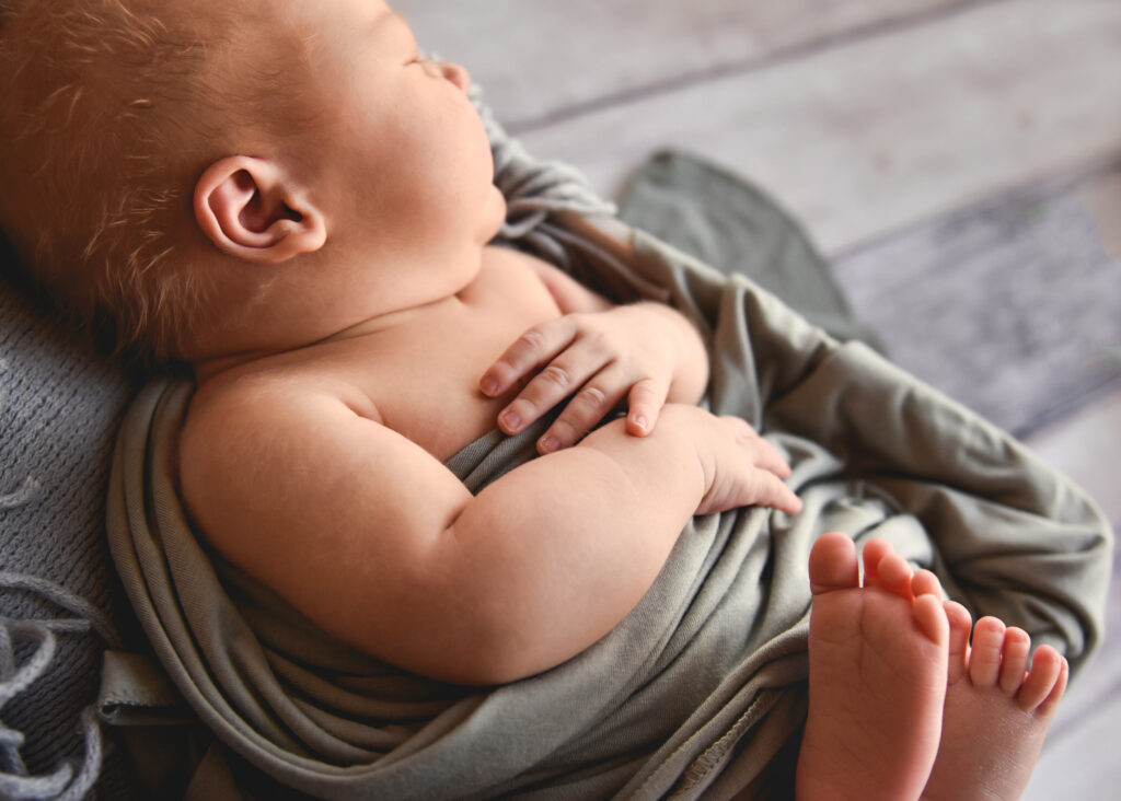 side view of baby hands and feet