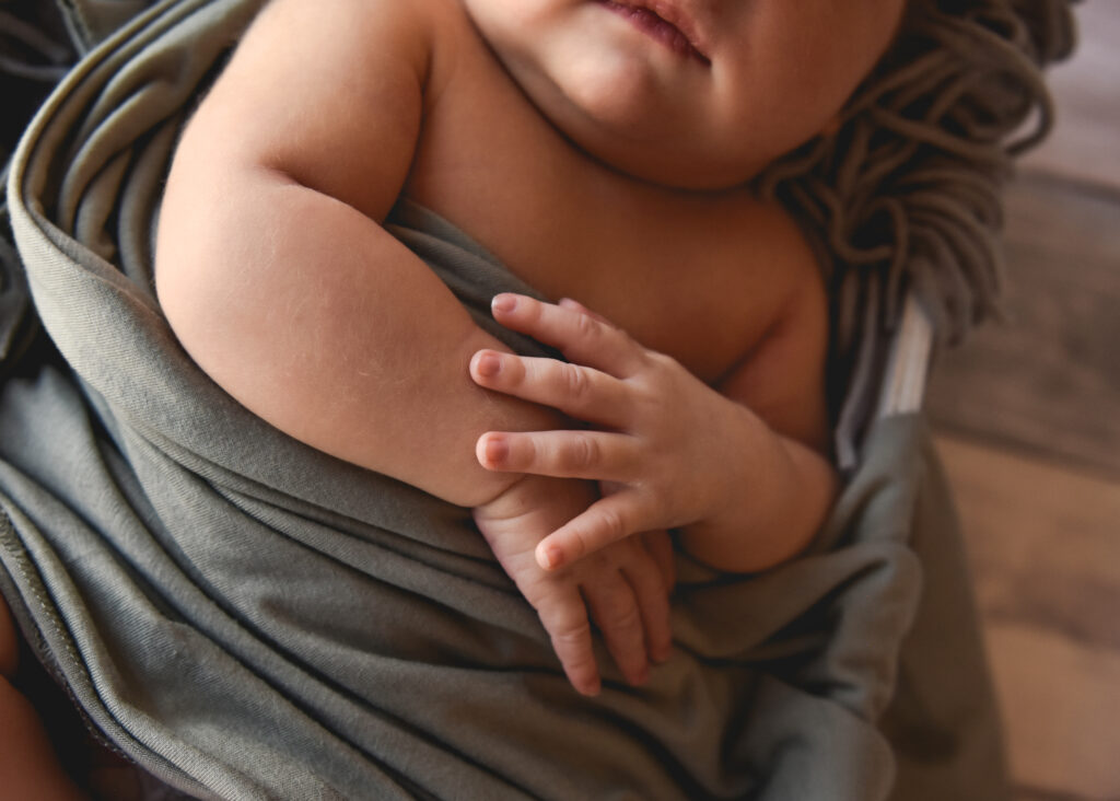 studio newborn session, closeup of baby hands