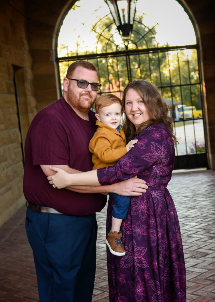 family-session-family-of-three-group-hug-marland-mansion